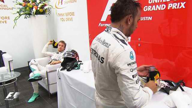 Nico Rosberg Throws His 2nd Place Cap at Lewis Hamilton
